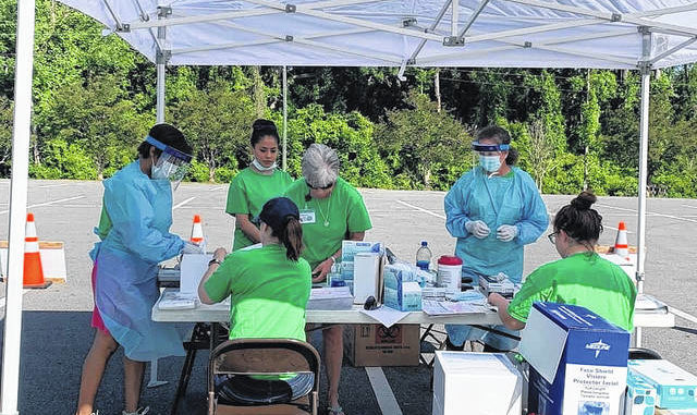 							                                Sampson County Health Department staff man a testing station.                                 Courtesy photo|County of Sampson					