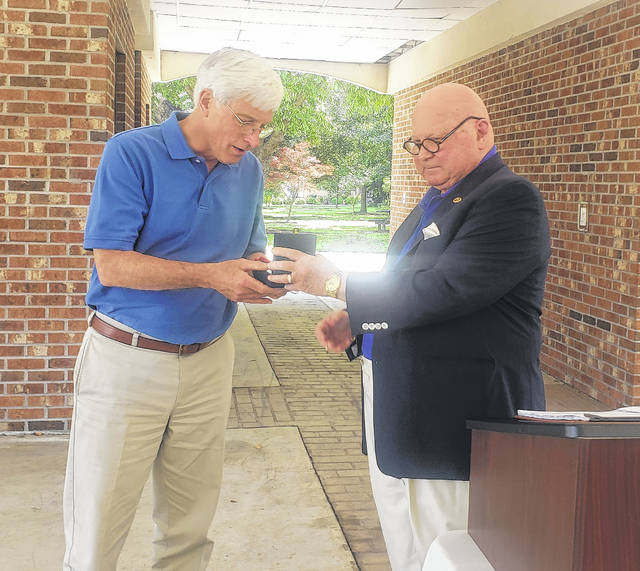 
			
				                                Dr. Paul Viser, left, accepts the Clinton-Sampson Rotary Club’s Service Above Self Award from outgoing club president Dr. Ken Benton.
 
			
		