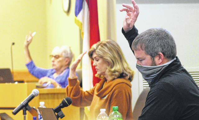 
			
				                                During a Tuesday work session, the Sampson County Schools Board of Education votes. Pictured, from left, are: Vice-Chair Sandra Carroll, Kim Schmidlin and Daryll Warren. While social distancing, board members took off their masks briefly to clearly communicate with their colleagues.
                                 Chase Jordan | Sampson Independent

			
		