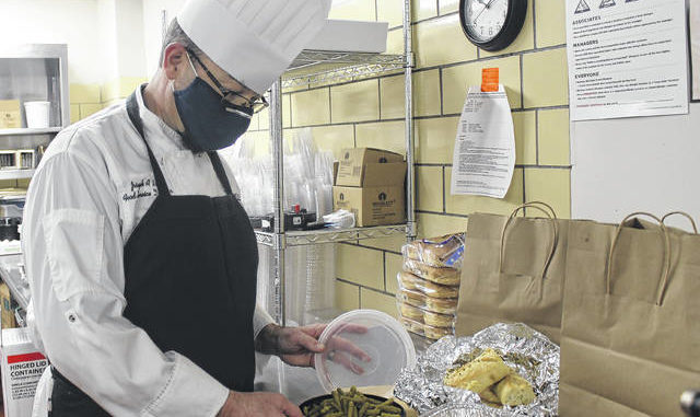 
			
				                                
			
				                                
			
				                                
			
				                                Joseph Hill prepares a meal for a family affiliated with Sampson Regional Medical Center.  Chase Jordan |  Sampson Independent

			
		