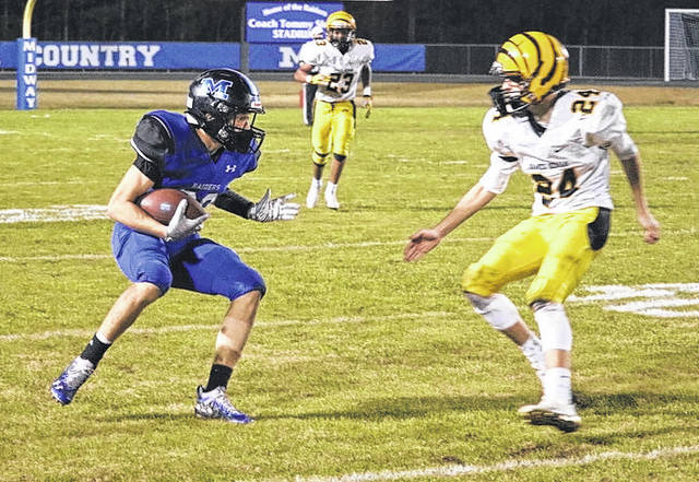 
			
				                                Midway’s Thornton Baggett jukes to the left around the defender and scurries down field for his 82-yard touchdown. Baggett had two receiving touchdowns on Friday.
 
			
		