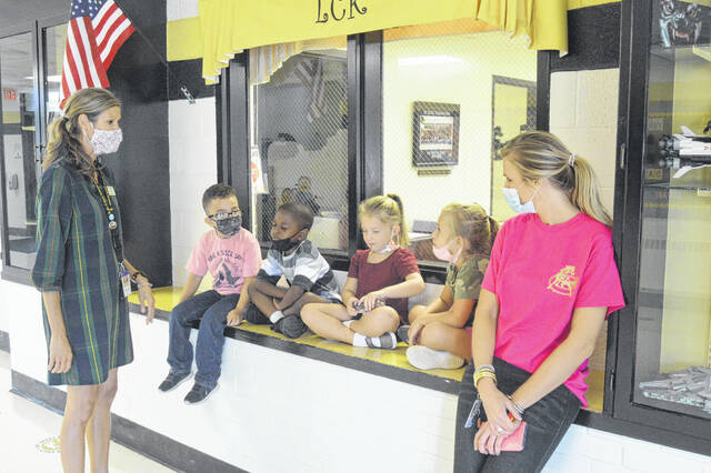 
			
				                                Teachers and students at LC Kerr waiting to give the tour of their school to Eugenia Floyd, NC Teacher of the Year, who was visiting. Pictured, from left, LC Kerr TOY Suzanne Rice, Percy Feliciano, Braelyn Wilson, Addaleigh Faircloth, Layla Anders and Olivia Herring.
                                 Michael B. Hardison | Sampson Independent

			
		