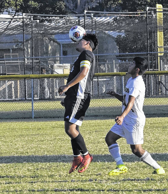 
			
				                                Oscar Acevedo heads the ball away from a Lakewood defender. Acevedo would be credited with one of Hobbton’s scores.
 
			
		