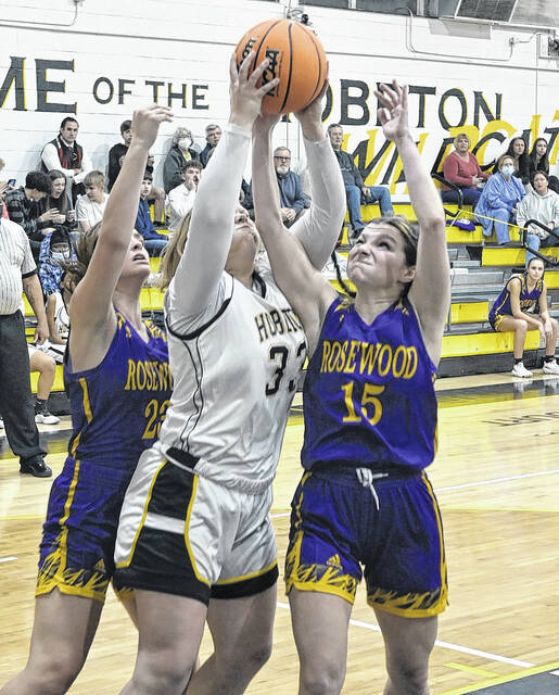 <p>Gracie Jones goes up amongst a couple of Rosewood players. She didn’t score any points; however, she was force rebounding.</p>