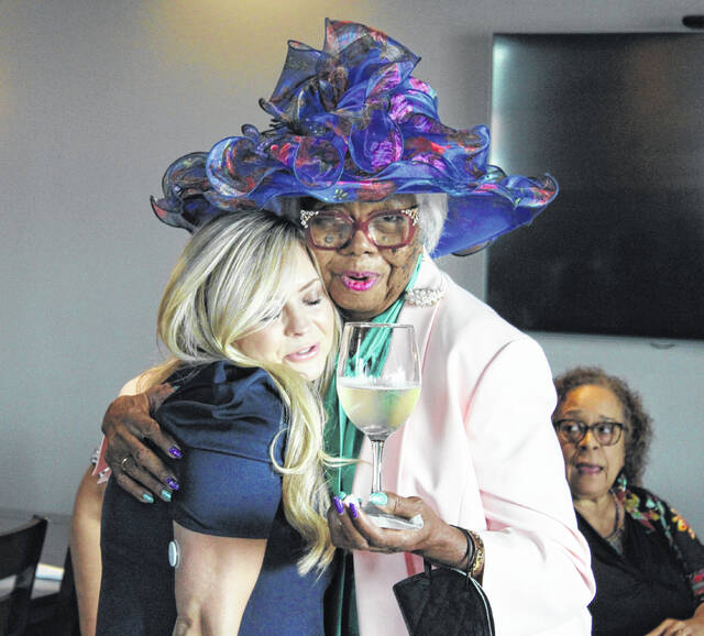 <p>United Way Executive Director Wendi Ferrell, left, and United Way of Sampson’s longest serving board member Patty Cherry share an embrace during the party.</p>
                                 <p>Michael B. Hardison | Sampson Independent</p>