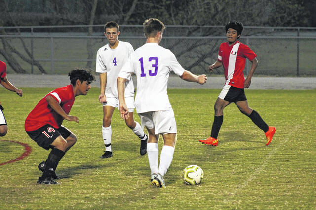 A Spartan defender squares up against opposition.
                                 Anthony McConnaughey|Sampson Independent