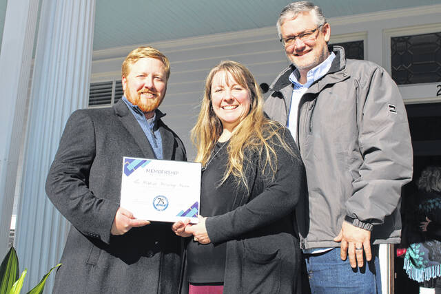 <p>Clinton-Sampson Chamber of Commerce Executive Director Matt Stone presented a certificate of membership to Daniel and Denise Rentz at the open house event. Pictured, from left, are Stone, Denise and Daniel Rentz.</p>
                                 <p>Michael B. Hardison | Sampson Independent</p>