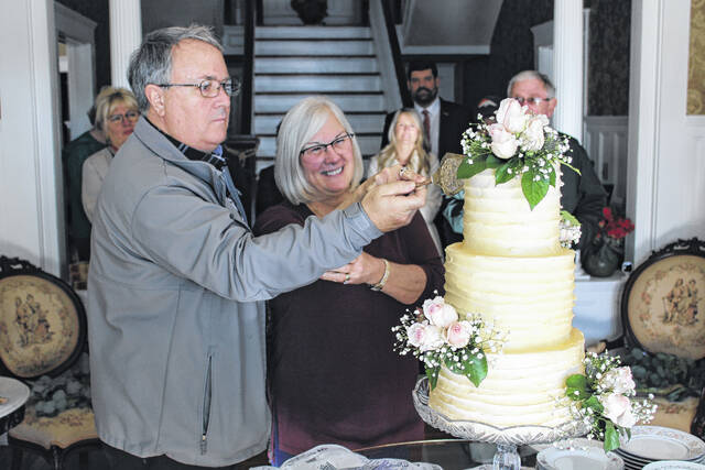 <p>Dan and Ginny Pflaume, friends of the Rentz family, got to celebrate their 45th wedding anniversary with style. They were surprised with the honor of cutting the first slice of this spectacular wedding cake present at the event. </p>
                                 <p>Michael B. Hardison | Sampson Independent</p>