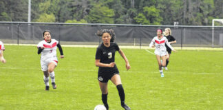 
			
				                                Kenzy Yang drives the ball upfield.
                                 File Photos|Sampson Independent

			
		